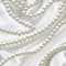 Pearl beads on silk fabric. A beautiful precious decoration. eps 10