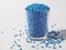 Pearl blue masterbatch granules on white background