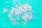 Pearl confetti on mint background.