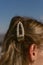 Pearl hairpin in the hair of a blonde girl