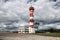 Pearl Harbor airport control tower against cloudy scenic sky.