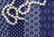 Pearl necklace background on indigo blue and white cloth