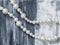 Pearl necklace on gray artistic background