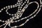 Pearl necklace isolated on black background