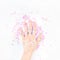 Pearl pastel confetti sparkles with woman hand