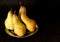 Pears harvest. Fruit background. Fresh organic pears. Pear autumn harvest. Juicy flavorful pears on black background