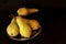 Pears harvest. Fruit background. Fresh organic pears. Pear autumn harvest. Juicy flavorful pears on black background