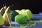 Pears with knitting yarn on wooden table