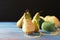 Pears with knitting yarn on wooden table