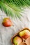 Pears on a linen napkin decorated with palm leaf