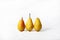 Pears. Three ripe juicy pears close-up arranged on white background