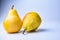  pears. Two whole yellow green pear fruits  on white with clipping path