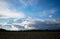 Peasantry with trees, fields and blue cloud sky at dusk. Location: Germany, North Rhine - Westphalia