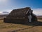 Peat church in Iceland with a bell above the door