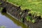 Peat extraction close-up in bog landscape at spring, old abandoned peat extraction area