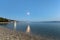 Pebble beach on Adriatic sea at night with Crikvenica town in the background