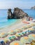 Pebble beach Monterosso Chairs and umbrellas on the beach of Cinque Terre Italy.