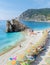 Pebble beach Monterosso vacation Chairs and umbrellas on the beach of Cinque Terre Italy at summer