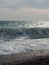 Pebble beach of Nice, France with azure waves of mediterranean sea