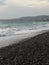 Pebble beach of Nice, France with azure waves of mediterranean sea