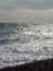 Pebble beach of Nice, France with azure waves of mediterranean sea