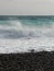 Pebble beach of Nice, France with azure waves of mediterranean sea