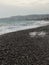 Pebble beach of Nice, France with azure waves of mediterranean sea