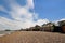 Pebble beach with a row of small huts