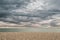 Pebble beach and stormy skies over English channel