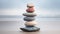 Pebble cairn, stack of smooth colorful pebbles on the seaside. Stone stack on the sand beach near a misty ocean. Generative AI
