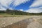 Pebble Creek under cumulus cirrus cloudscape in the Lamar Valley in Yellowstone National Park in Wyoming USA