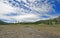 Pebble Creek under cumulus cloud skies at the east end of the Lamar Valley in Yellowstone National Park