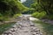 pebble path leading to a sequestered hot spring
