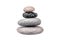 Pebble pile on white background isolated close up, stack of balanced zen stones, smooth sea pebbles pyramid, cobblestones tower