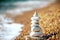 Pebble pyramid on the beach.