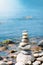 Pebble pyramid in the sunny day.On the sea shore a pyramid of stones. Dream on the beach