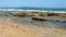 Pebble sandstone beach, waves breaking in from the sea