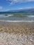 Pebble secluded beach, before the summer