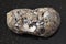 pebble of sphalerite stone with Galena on dark