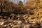 Pebble stack on boulder in dry riverbed in wilderness park