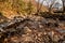 Pebble stacks in dry riverbed in wilderness park