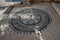 Pebble stone mosaic. Rosetta floral motif. Pavement. Lindos Town. Greek Island of Rhodes. Europe