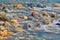 Pebble stones in the river water close up view