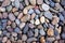 Pebbles background. Gravel background. Colorful pebbles background