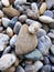 Pebbles background. Various stones of different shapes and sizes.