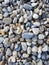 Pebbles background. Various stones of different shapes and sizes.