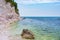 Pebbles beach colorful bay in Conero natural park dramatic coast headland rock cliff adriatic sea tourism destination Italy