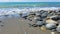 Pebbles on the beach, rubble on the seashore, top view