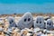 Pebbles with drawn faces in the sand. Father, mother, daughter and son. Family vocation concept