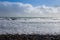 Pebbles, Mediterranean sea and a cloudy sky